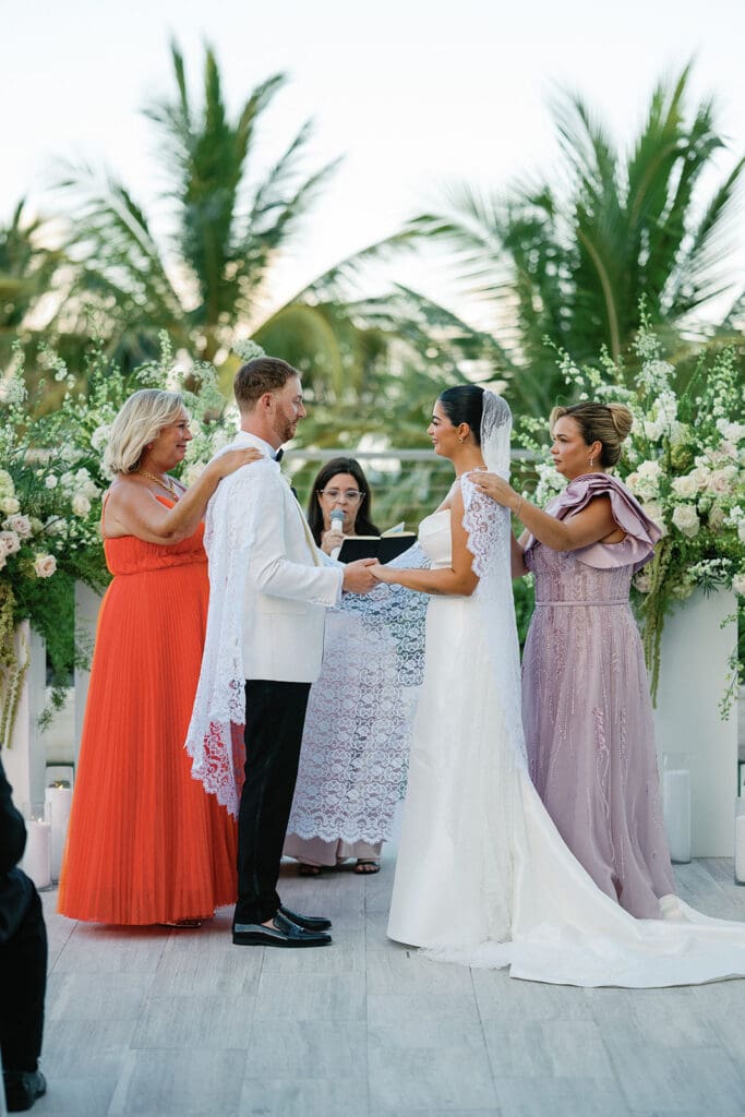 The Miami Beach Edition Wedding ceremony bride and groom receiving blessing