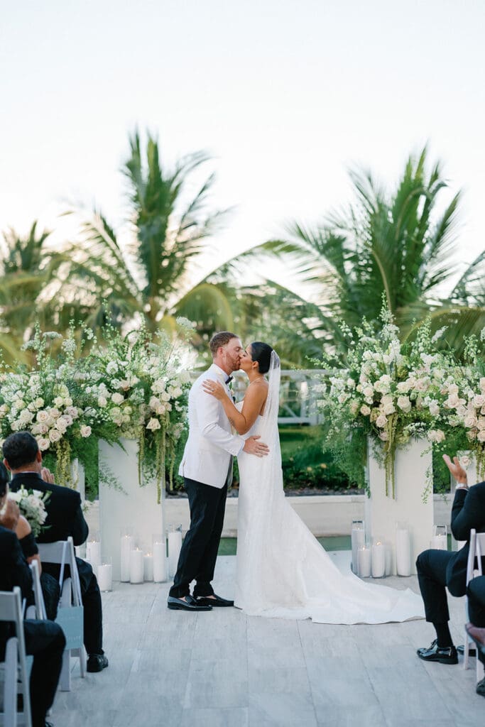 The Miami Beach Edition Wedding ceremony bride and groom first kiss